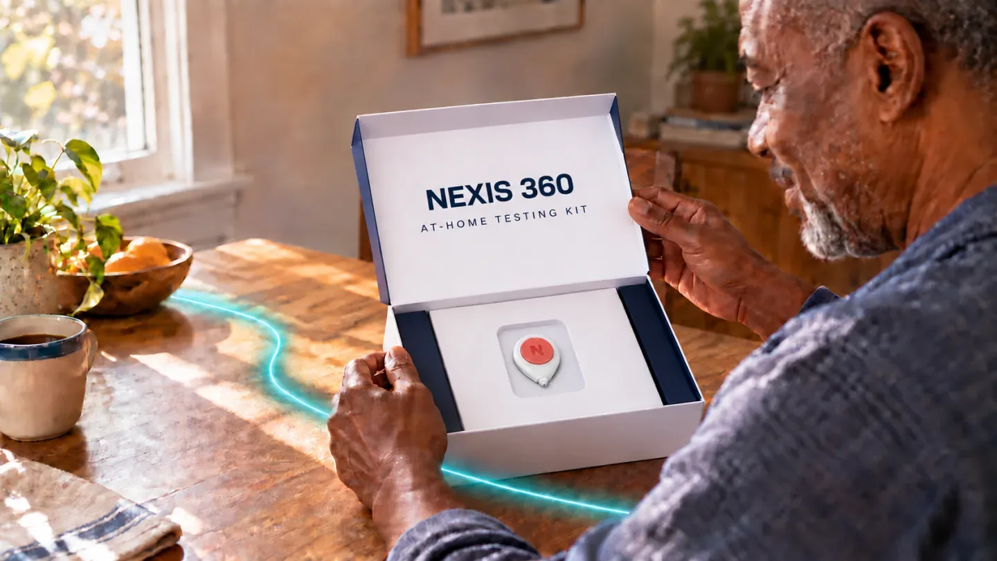 A man opening a Nexis 360 at-home testing kit at his kitchen table